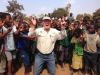 Goddard in Africa surrounded by children