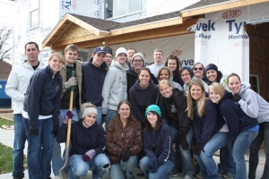 Around twenty accounting students helped build Mary Cisneros’s (center) new home at a Habitat for Humanity event, sponsored by BYU’s chapter of Beta Alpha Psi.