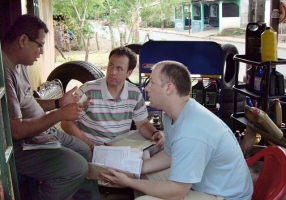 Paul Winterowd and Paul Rowley consulting with Axel,   a small business owner in Nicaragua.