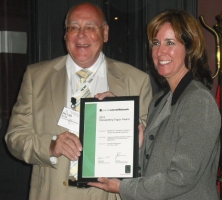 Kristen DeTienne receiving the Outstanding Paper award from Emerald advisor, David Weir, at the Academy of Management Conference in Montreal.  