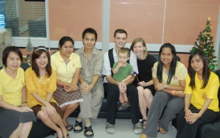 David Griffith, his wife Jade Grimmius and their son Ezra (center) with the business department staff at Chulalongkorn University in Bangkok, Thailand.