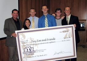 Members of Laughs for Life present a check for more than $6,500 to Tim Meade, head of Tiny Tim and Friends. From L to R: Tim Meade, Kathlyn de la Rosa, Nathan Jergensen, Greg Conover, David Nance and Adam Bourgeois.