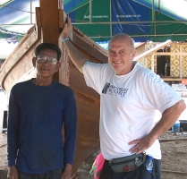 Professor Warner Woodworth working with a native boat builder in Khao Lak, Thailand.