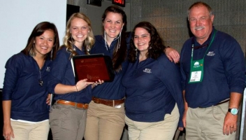 First-place winners Elicia Merwin, Catherine Truman, Alexi Trotter and Miranda Deighton pose next to faculty adviser Brian Hill. The team took first place at the annual National Recreation and Parks Association Quiz Bowl.