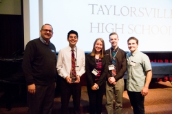 The winning team from Taylorsville High School poses with GMC director and the CEO of Thread Wallet.