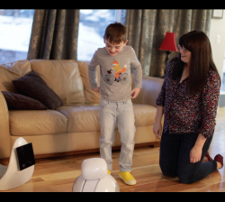 Nelli, the robot, with a child in his home.