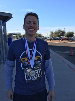 Daniel Rellaford with his medal after running a 5K in Pheonix.