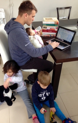 Villanova studying with his kids around him.