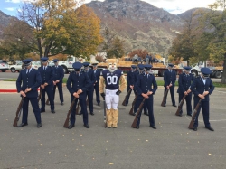 ROTC Air Force Honor Guard stands in formation with BYU Mascot Cosmo the Cougar