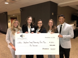 The five members of the BYU team pose with a large check for $5,000. There are four women, one blonde, the other three brunette, and one male.