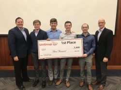 Left to right: Marc Rogers, UniGroup's CEO, first-place team members , Paeton Murdock, Masyn Barney, Dallin Shields, and Nathan  Schwartz. Photo courtesy of Simon Greathead.