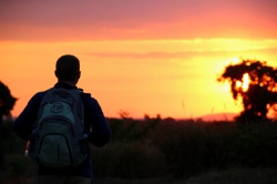 Eli Tucker looks into the sunset while on a study abroad trip to Africa