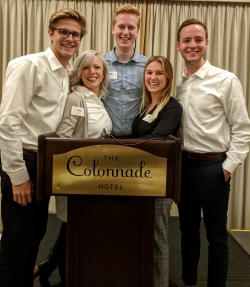 BYU Marriott adjunct professor Liz Dixon with students at a case competition