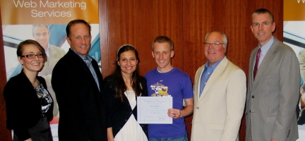 Saul Howard, winner of the Crexendo Website Competition, with judges from the Rollins Center and Crexendo