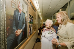 Elma Stoddard and Patricia Stoddard Welch unveil the George E. Stoddard display.
